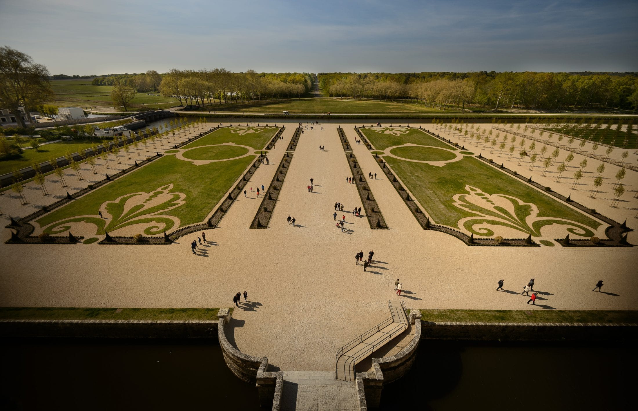 Aerial view of the formal gardens at Château de Chambord in France showcasing symmetrical design and historic beauty.